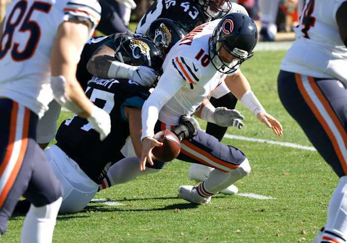 Dec 27, 2020; Jacksonville, Florida, USA; Jacksonville Jaguars linebacker Joe Schobert (47) strips the ball from Chicago Bears quarterback Mitchell Trubisky (10) during the second quarter at TIAA Bank Field. Mandatory Credit: Reinhold Matay-USA TODAY Sports